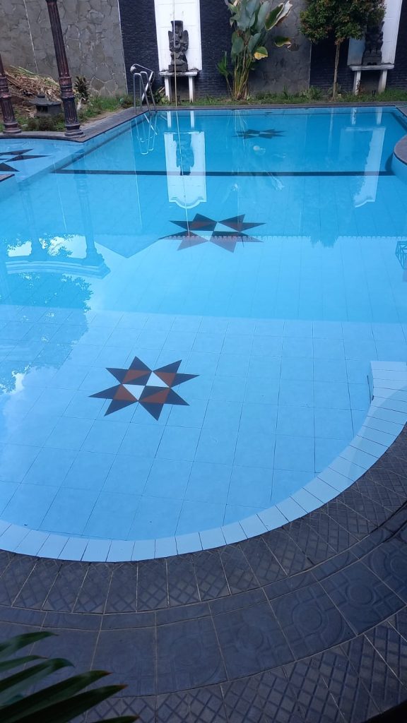Peaceful swimming pool at academic guesthouse near UGM